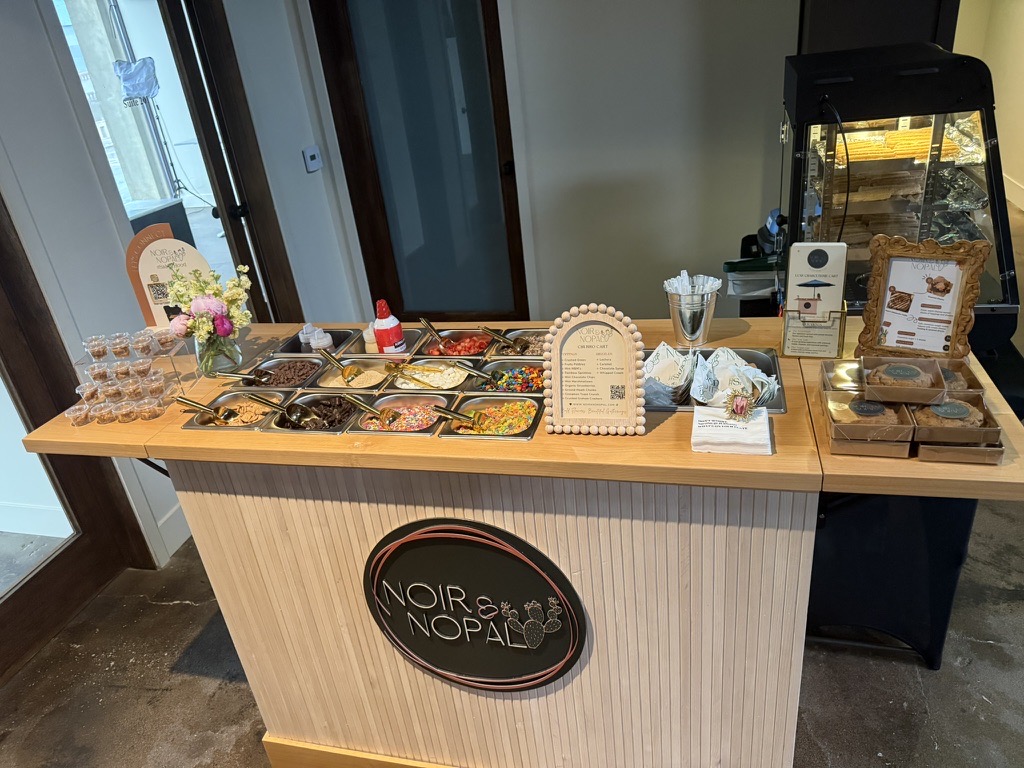 The Churro Ice Cream Sundae Cart styled and stocked, with pre-packed treats on display