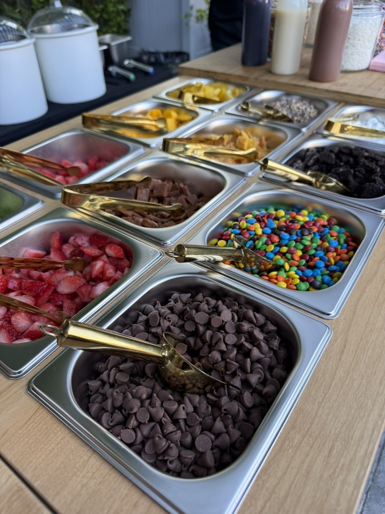 The full topping bar, with ice cream containers visible behind